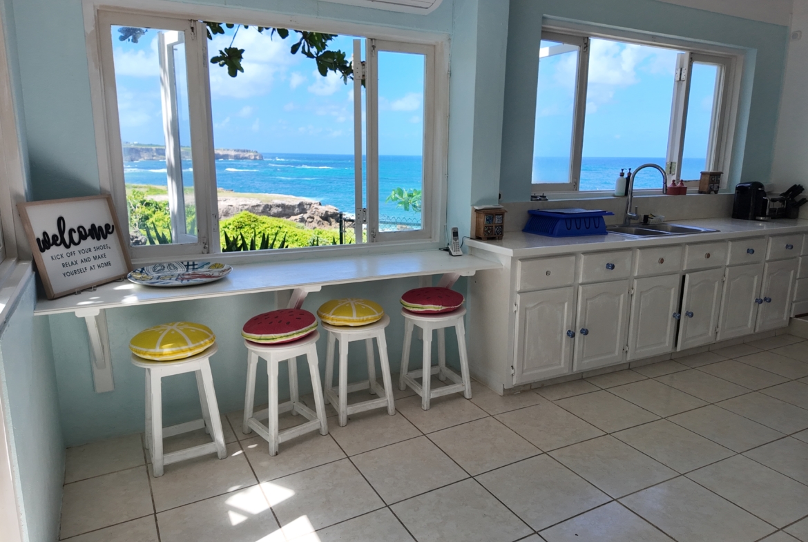 Lighthouse Landing view of ocean from two kitchen windows scaled